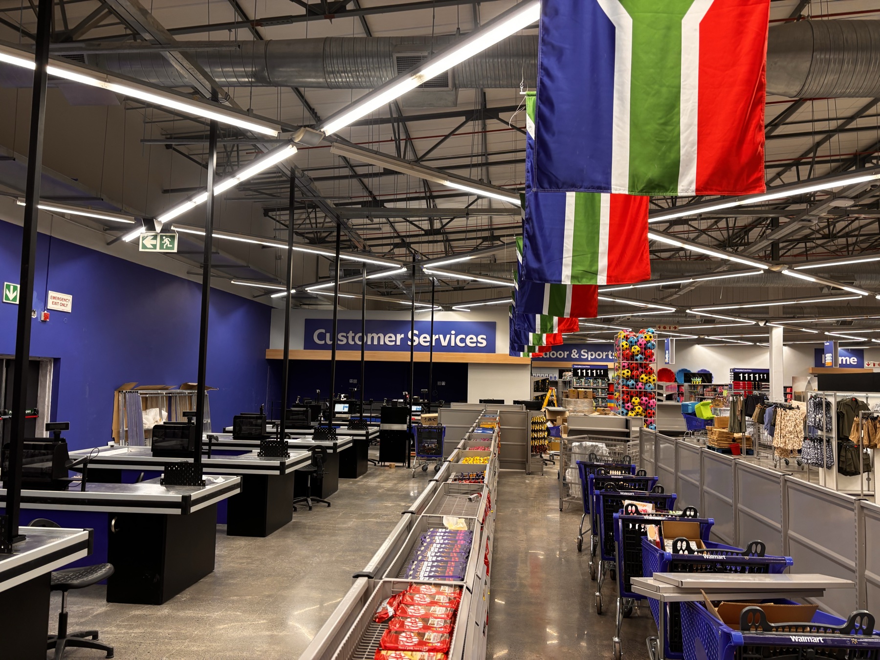 Retail customer service area with hanging banners and in-store graphics